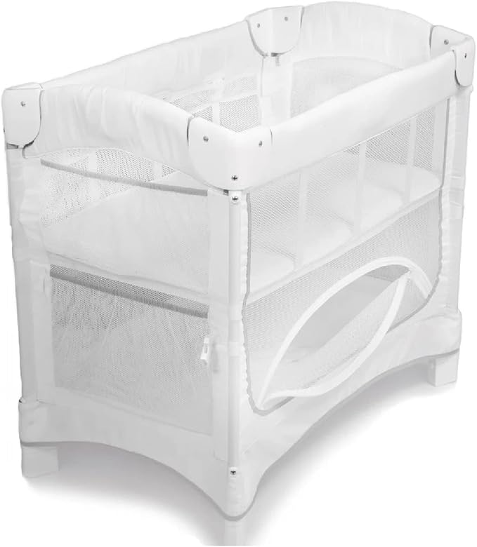 Arm’s Reach Mini Ezee 2 in 1 Co-Sleeper Bedside Bassinet Featuring Breathable Mesh Side Panels with 2 Wheels for Portability, Side Pockets, and Bottom Storage, White