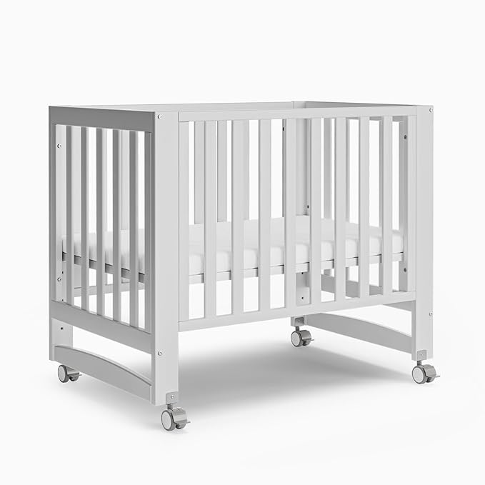EvoNest Baby Crib, 6 in 1 Convertible Mini Crib with Wheels, 100% New Zealand Pinewood Growing Bed, 4 Adjustable Mattress Height, (Milk)