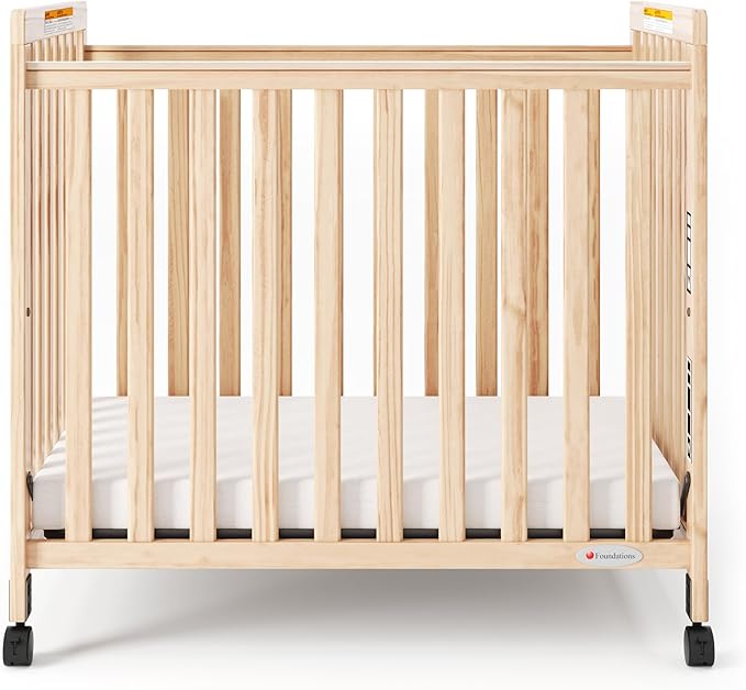 Foundations SafetyCraft Clearview Compact Daycare Crib, Durable Wood Construction, Non-Marking Casters (2 Locking), Includes 3” InfaPure Foam Mattress (Natural)