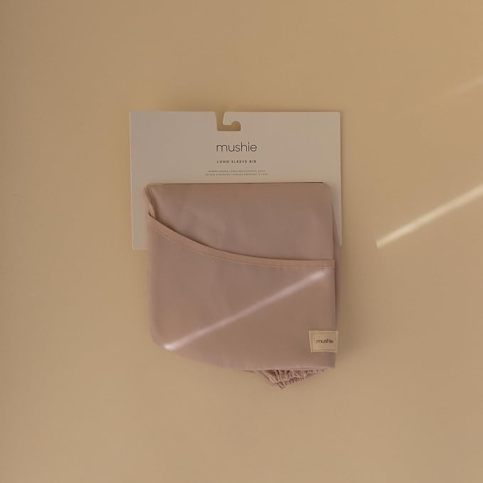 mushie Long Sleeve Baby Bib | Water Resistant Adjustable Fit for Ages 6-24 Months