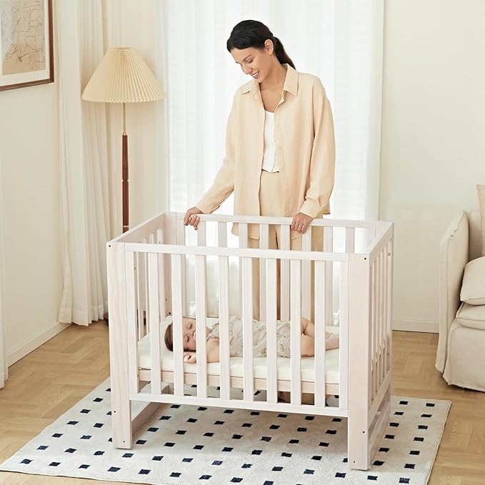 EvoNest Baby Crib, 6 in 1 Convertible Mini Crib with Wheels, 100% New Zealand Wood Growing Bed, 4 Adjustable Mattress Height, Washed Natural