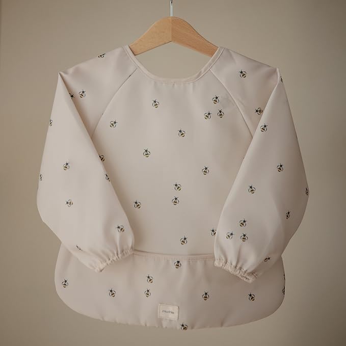 mushie Long Sleeve Baby Bib | Water Resistant Adjustable Fit for Ages 6-24 Months