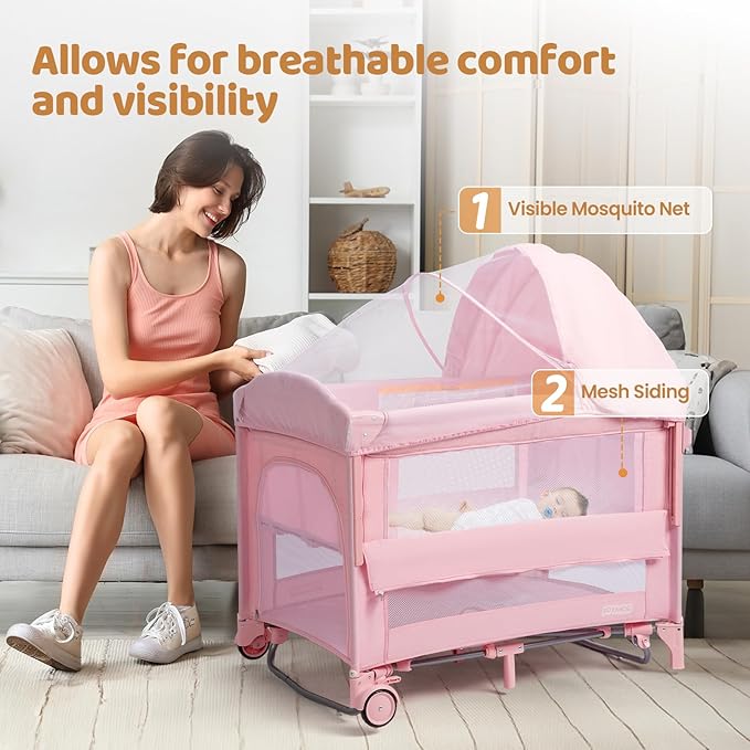 JOYMOR 9 in 1 Bedside Bassinet with Changing Table, Pack and Play with Bassinet, Convert to Rocking Baby Bed with Electric Music Center, Mosquito Net, Toy, Storage,Pink