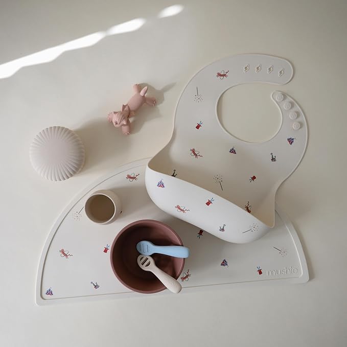 mushie Silicone Baby Bib | Adjustable Fit Waterproof Bibs (Circus)