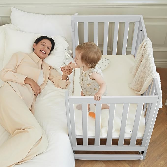 EvoNest Baby Crib, 6 in 1 Convertible Mini Crib with Wheels, 100% New Zealand Pinewood Growing Bed, 4 Adjustable Mattress Height, (Milk)