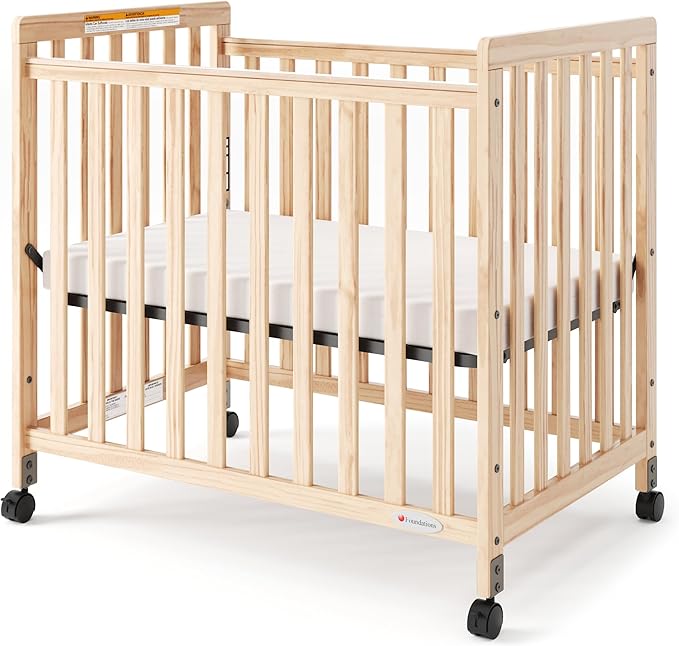 Foundations SafetyCraft Compact Slatted Daycare Crib, Durable Wood Construction, Non-Marking Casters (2 Locking), Includes 3” InfaPure Foam Mattress (Natural)