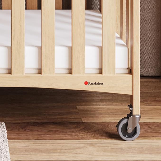 Foundations Travel Sleeper Wood Compact Folding Crib with 2” InfaPure Foam Crib Mattress and Commercial Grade Casters for Hotels (Natural)