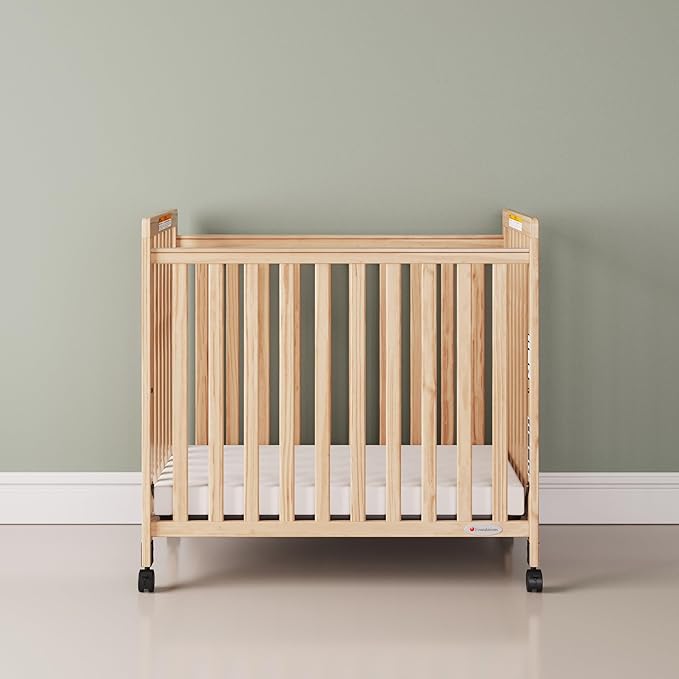 Foundations SafetyCraft Compact Slatted Daycare Crib, Durable Wood Construction, Non-Marking Casters (2 Locking), Includes 3” InfaPure Foam Mattress (Natural)