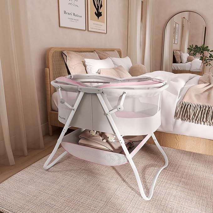 Dream On Me Karley Baby Bassinet in Grey and Pink, Lightweight Portable, Quick Fold and Easy to Carry , Adjustable Double Canopy, Indoor and Outdoor with Large Storage Basket.