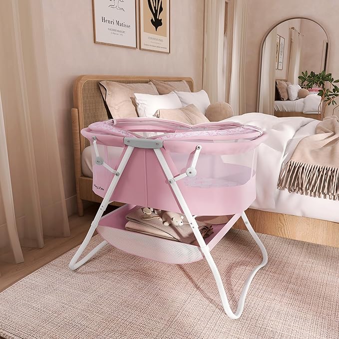 Dream On Me Karley Bassinet in Pink, Lightweight Portable Baby Bassinet, Quick Fold and Easy to Carry, Adjustable Double Canopy, Indoor and Outdoor Bassinet with Large Storage Basket.