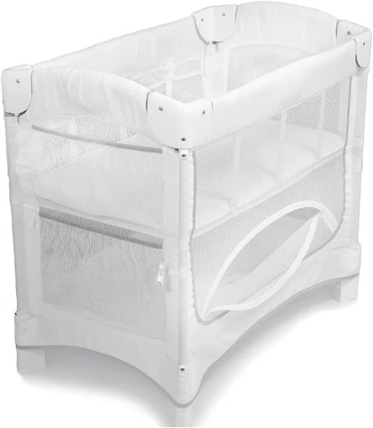 Arm’s Reach Mini Ezee 2 in 1 Co-Sleeper Bedside Bassinet Featuring Breathable Mesh Side Panels with 2 Wheels for Portability, Side Pockets, and Bottom Storage, White