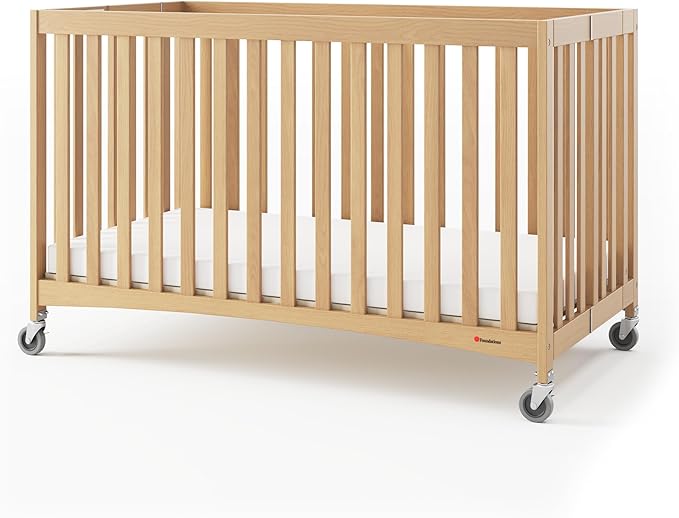 Foundations Travel Sleeper Full-Size Wooden Folding Crib with 3” InfaPure Foam Mattress and Commercial Grade Casters, Hotel Crib (Natural)