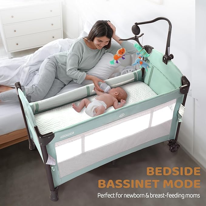 JOYMOR Baby Bassinet, Pack and Play with Bassinet and Carry Bag, Convert to Bedside Sleeper with Toy, Wheels for Boys Girls (Green)