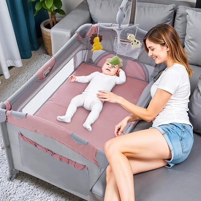 5 in 1 Baby Crib,Bedside Sleeper,Bassinet,Pack and Play with Bassinet and Changing Table,Portable Travel Playpen Music Box,Portable Travel Crib for Infant Newborn (Pink Gray)