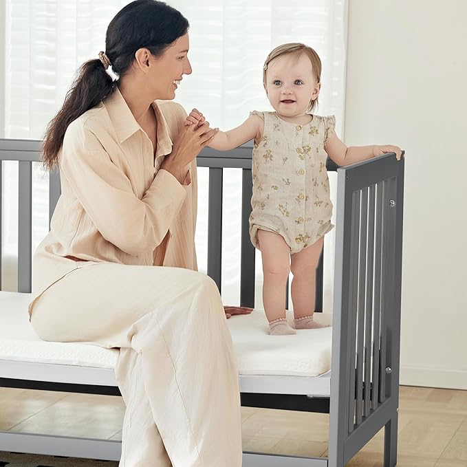 EvoNest Baby Crib, 6 in 1 Convertible Mini Crib with Wheels, 100% New Zealand Wood Growing Bed, 4 Adjustable Mattress Height，Grey