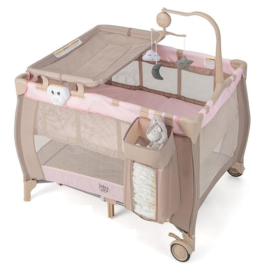Costzon 3 in 1 Pink Pack and Play with Bassinet, Portable Baby Playard with Changing Table, Music Box, Whirling Toys, Wheels/Brake, Basket, Bag, Foldable Infant Pink Bassinet for Baby Girl Toddlers