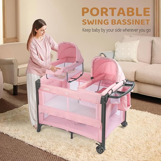 JOYMOR Twin Bassinet for Baby, Pink Bedside Bassinet, Convertible to Bedside Sleeper and Playpen, with Wheel, Brake, Foldable Side Sleeper