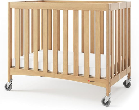 Foundations Travel Sleeper Wood Compact Folding Crib with 2” InfaPure Foam Crib Mattress and Commercial Grade Casters for Hotels (Natural)