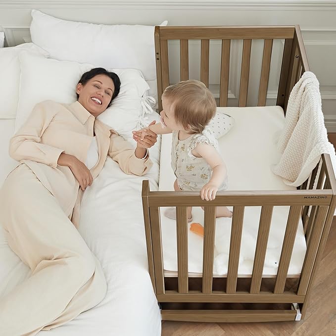 EvoNest Baby Crib, 6 in 1 Convertible Mini Crib with Wheels, 100% New Zealand Wood Growing Bed, 4 Adjustable Mattress Height，Walnut Brown