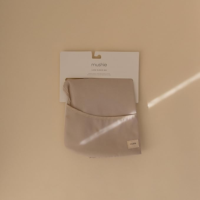 mushie Long Sleeve Baby Bib | Water Resistant Adjustable Fit for Ages 6-24 Months