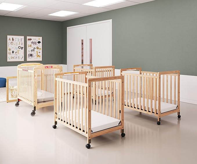 Foundations SafetyCraft Clearview Compact Daycare Crib, Durable Wood Construction, Non-Marking Casters (2 Locking), Includes 3” InfaPure Foam Mattress (Natural)