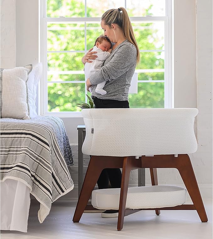 Evi Smart Baby Bassinet Beside Sleeper with Auto-Glide, Ambient Nightlight & Sensory Sounds, Compatible with Alexa and Google Home, Includes 2 Sheets (Soft White W/Natural Legs)