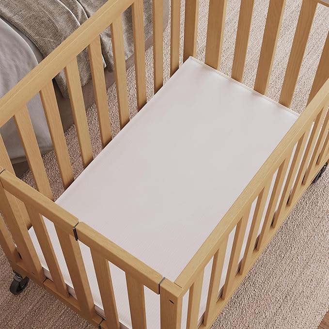 Foundations Travel Sleeper Wood Compact Folding Crib with 2” InfaPure Foam Crib Mattress and Commercial Grade Casters for Hotels (Natural)